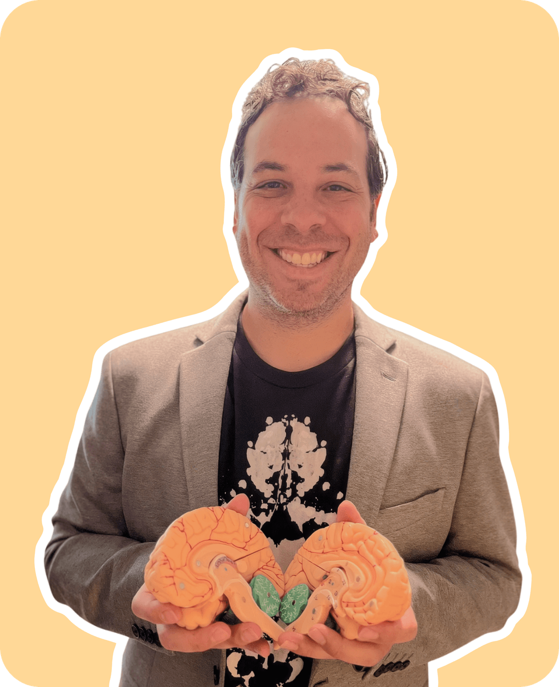 Dr. Steven Kushner holding a model brain